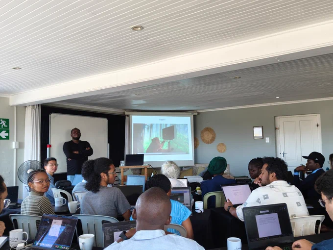 Prof. Felix Deku is showing a neuralink.com video with a monkey and a BCI.