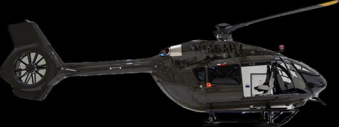 Black helicopter showcasing Helipaddy innovations in aviation technology.