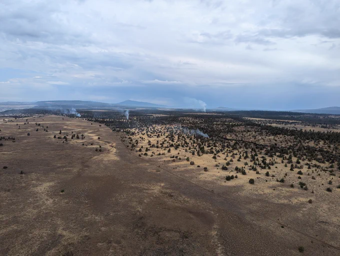 Three smoke columns are seen in the distance on the BLM Lakeview District. Photo by Dalton Loveless.