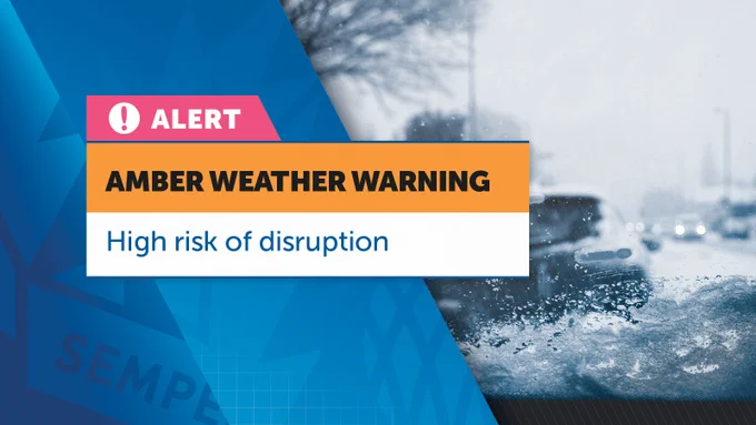 On the left side, there's a pink and white box with a warning icon and the word "ALERT" written in it. Below this, an orange box with "AMBER WEATHER WARNING" in bold black letters is displayed. Underneath, a white box contains the text "High risk of disruption" in blue letters. The right side of the image features a blurred, blue-tinted photograph of a snowy/icy road with vehicles, indicating hazardous weather conditions.