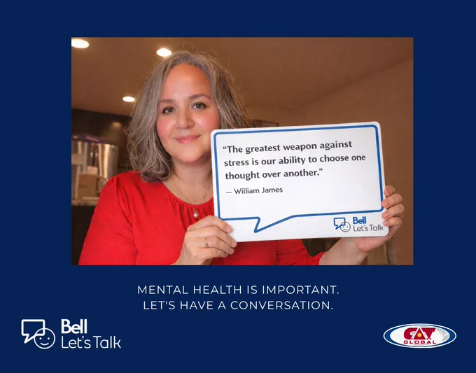 A person wearing a red top is holding a Bell Let's Talk sign with a quote by William James that reads: “The greatest weapon against stress is our ability to choose one thought over another.” The background is an indoor setting, and the design includes Bell Let's Talk and C.A.T. Global logos below a message that says: “Mental health is important. Let’s have a conversation.”