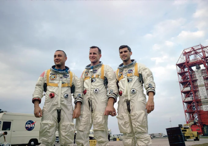 The Apollo 1 crew stands together for a group portrait wearing their flight suits. From left to right: Virgil I. Grissom, Edward H. White, Roger B. Chaffee. Credit: NASA.