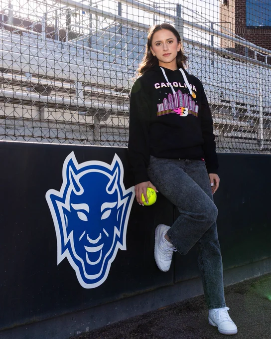 Ana Gold poses at Duke in Carolina Blaze merchandise