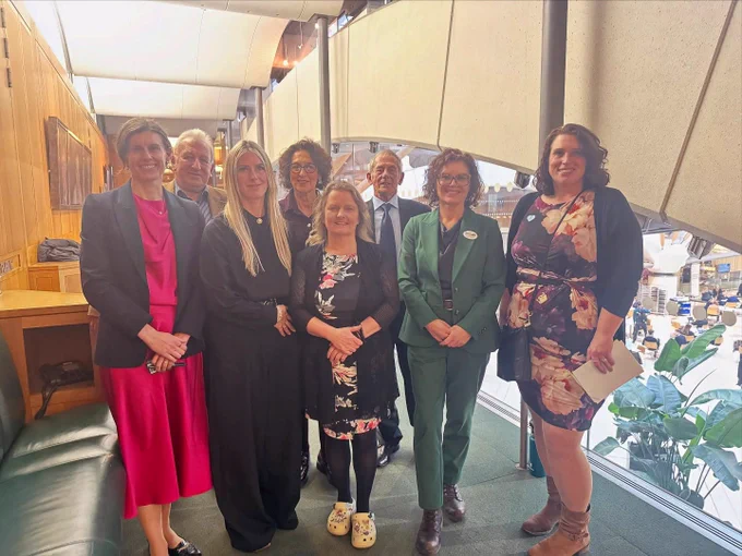 Photo of Jessica Toale, MP with the Autism Action team, event speakers and supporters.