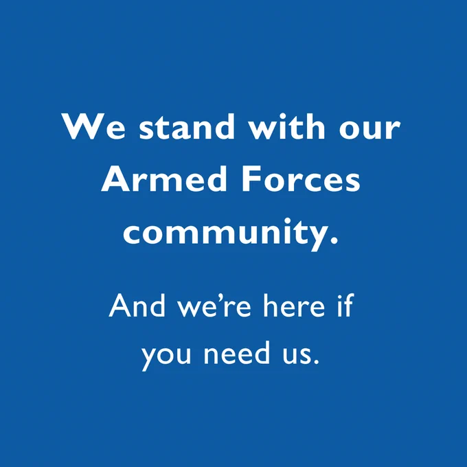 The words “We stand with our Armed Forces community. And we’re here if you need us.” read in white text on a dark blue background.