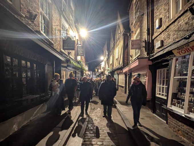 Mark Graham walking his guests down the Shambles.
