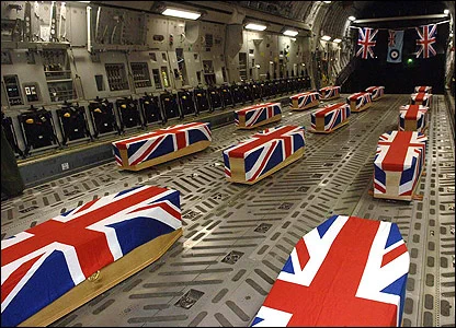 coffins on an RAF aircraft draped in Union Flags