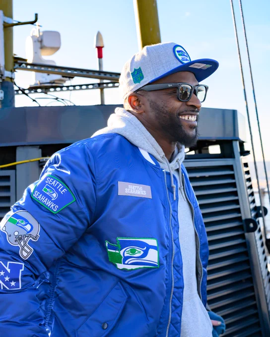 Cliff Avril raising 12 flag