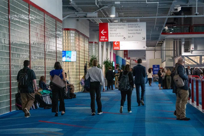 Attendees walking through the hallway.