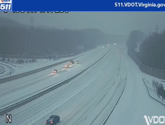 Snow-covered I-95 near Annandale with light traffic and overcast sky.
