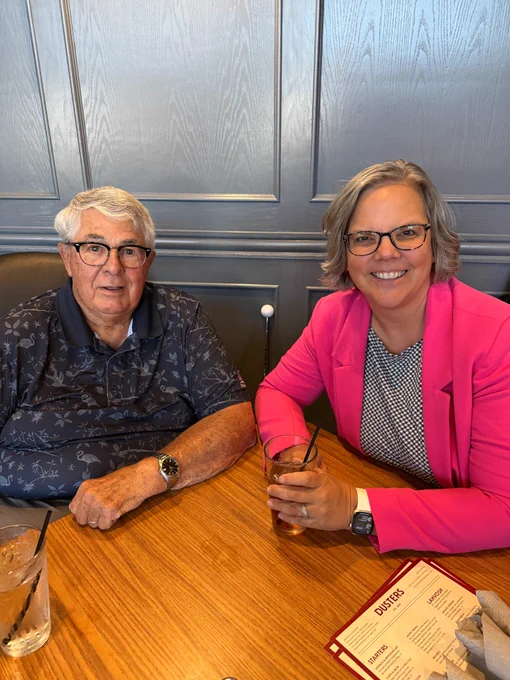 ESU 7 Board Member and ESU 7 Chief Administrator sitting at a table. 