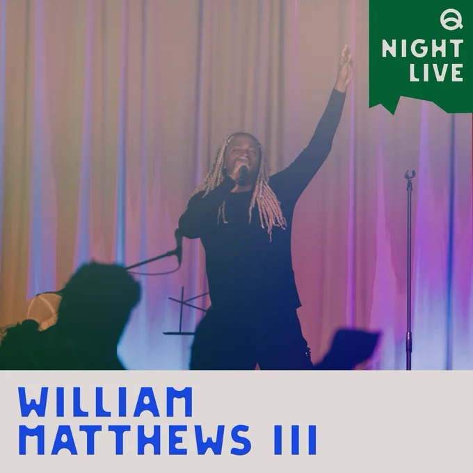 A photo of William Matthews III singing on stage.