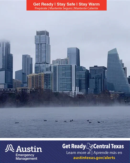The downtown Austin skyline viewed from Lady Bird Lake with fog coming off the water / El horizonte del centro de Austin visto desde el lago Lady Bird, con neblina elevándose desde el agua.