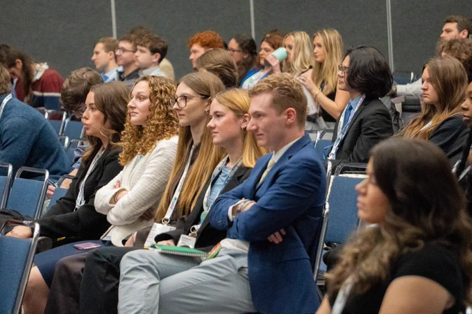 Student attendees listening to a session.