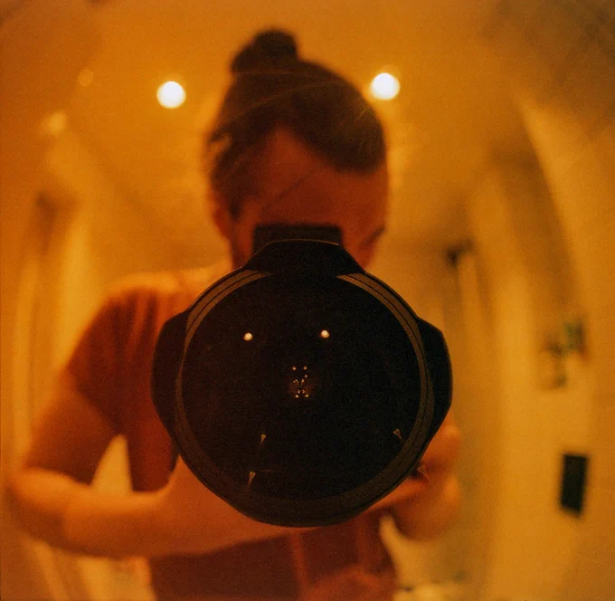 Mirror selfie with a fisheye lens.