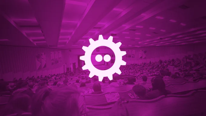 Photo edit of the main FOSDEM room with a purple shade and the white FOSDEM logo on top.