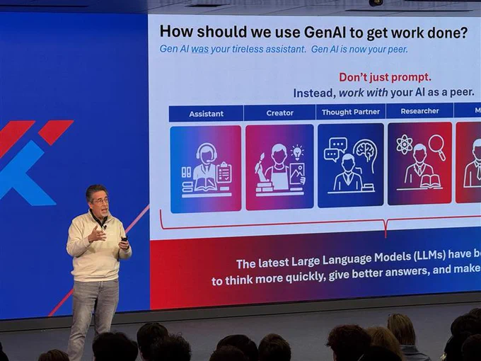 A speaker presents on \"How should we use GenAI to get work done?\", emphasizing AI as a peer rather than an assistant, with visuals showing roles like Assistant, Creator, Thought Partner, Researcher, and Maker.