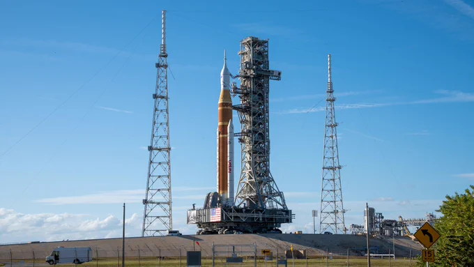 NASA\u2019s massive crawler-transporter, upgraded for the Artemis program, carries the powerful SLS rocket and Orion spacecraft on the Mobile Launcher from the Vehicle Assembly Building to Launch Pad 39B at Kennedy Space Center in preparation for the Artemis II mission. Credit: NASA/Brandon Hancock
