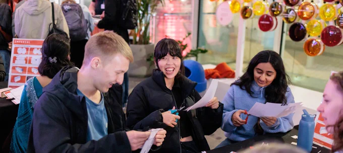 Photograph of people enjoying an activity at the Imperial Lates event.