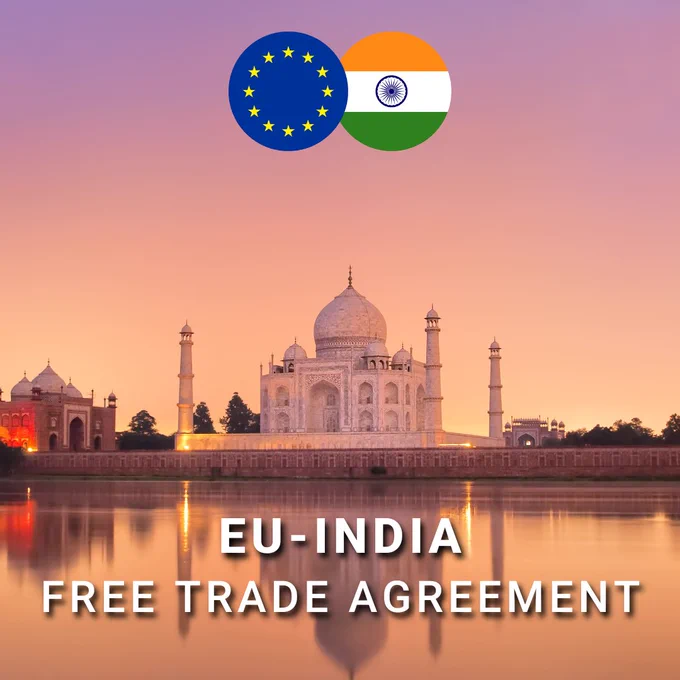 Stylized graphic showing the Taj Mahal at sunset reflected in water, with circular icons of the European Union and Indian flags overlapping above it. White text at the bottom reads ‘EU–India Free Trade Agreement.’ 