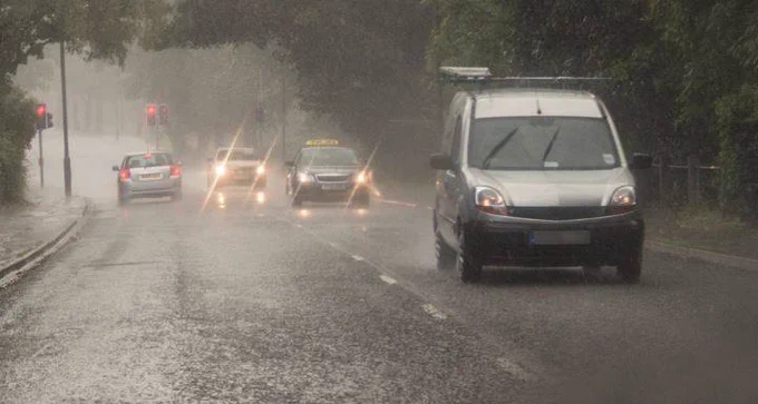 Image of vehicles driving on wet roads