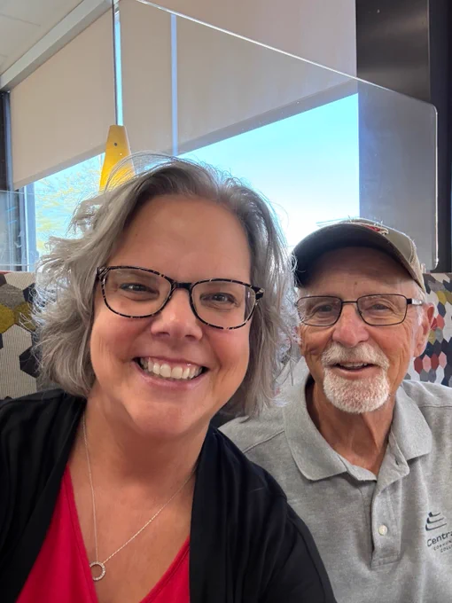 ESU 7 Chief Administrator with a board member. 