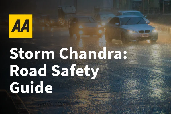 Cars driving on a wet road in heavy rain at night with AA logo and text: Storm Chandra: Road Safety Guide.