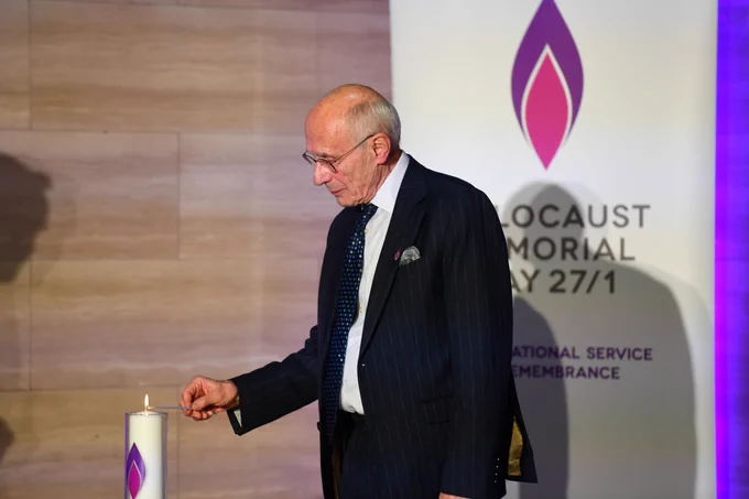 Holocaust survivor Peter Lantos BEM lights the HMD candle in memory of all who lost their lives.