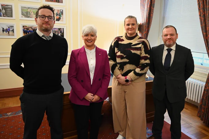 Image of four people - Junior Ministers Aisling Reilly and Joanne Bunting with Carnegie UK’s Adam Lang (Director of policy, insight and advocacy) and Stuart Mackinnon (Head of communications and advocacy) ahead of their meeting at Parliament Buildings.