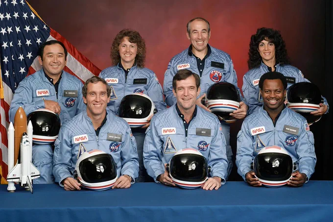 Portrait of the STS-51L crew: Back row: Mission Specialist Ellison S. Onizuka, Payload Specialists Christa McAuliffe and Gregory B. Jarvis, Mission Specialist Judith A. Resnik, Front Row: Pilot Michael J. Smith, Commander Francis R. Scobee, Mission Specialist Ronald E. McNair.