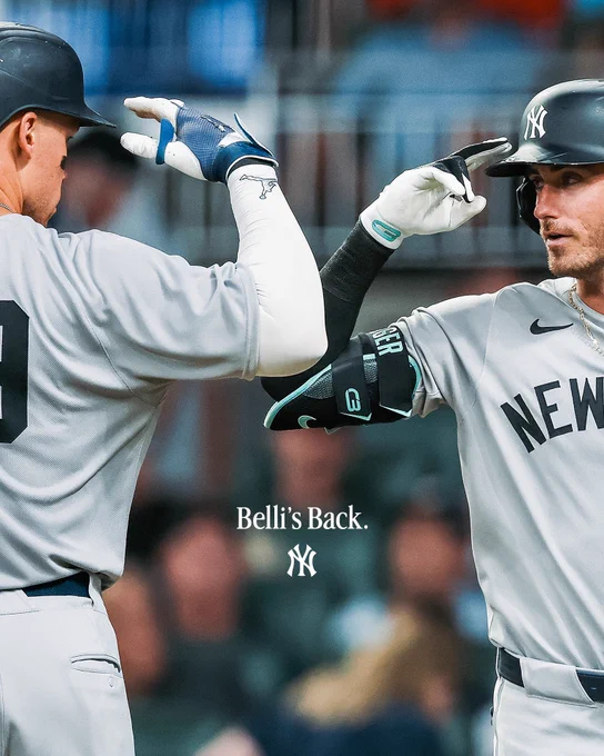 Aaron Judge and Cody Bellinger salute after a home run.