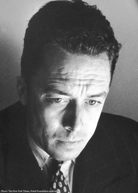 Black and white portrait of Albert Camus, looking thoughtful.