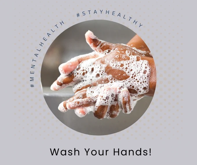 A close-up photograph of clasped medium-tone hands covered in soap bubbles.