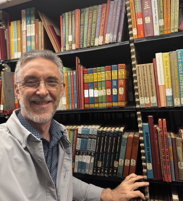 Ralph Pantozzi, the Library’s 2024-2025 Albert Einstein Distinguished Educator Fellow and New Jersey math teacher, finds inspiration in the arithmetic section of the Adams Building book stacks.
