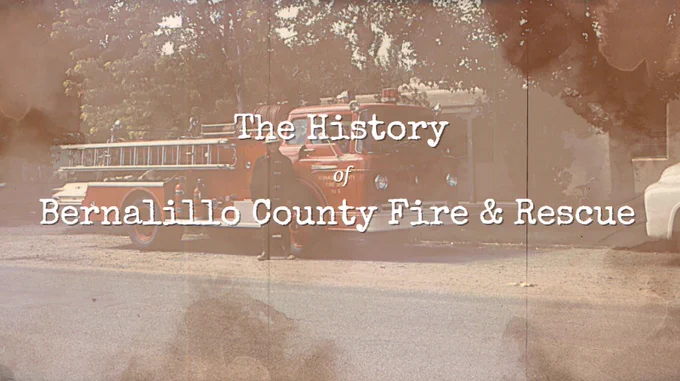A sepia-toned title card reading “The History of Bernalillo County Fire & Rescue” over a vintage photo of an old red fire engine parked on a tree-lined street, with a textured, film-like overlay that gives the image a historic feel.
