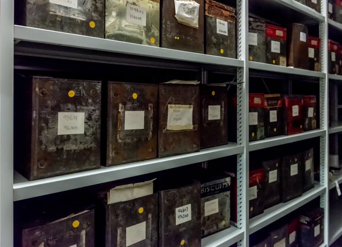 Multiple rows of shelves filled with boxes containing photographic negatives.