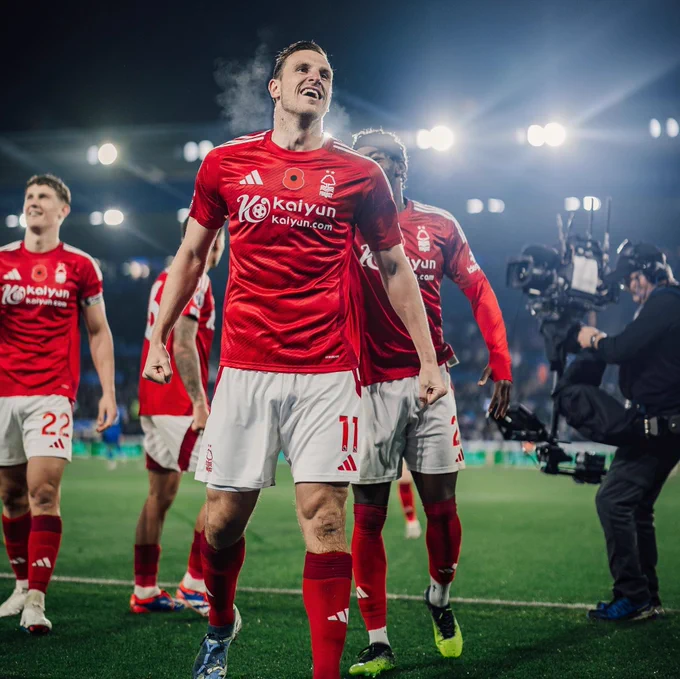 Chris Wood and Nottingham Forest players celebrate with the away fans