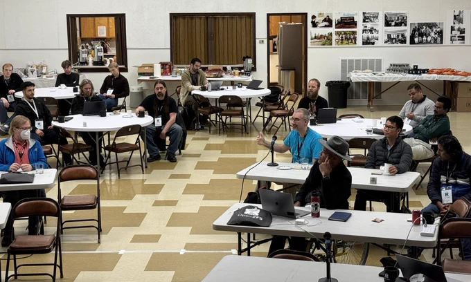 A hall full of seated attendees.