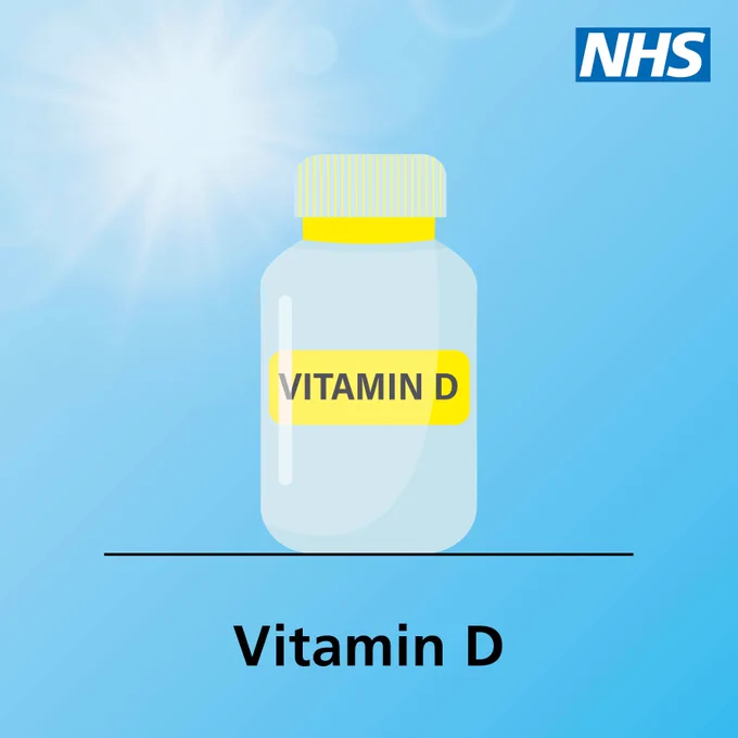 The image shows a blue background with a bottle labeled "Vitamin D" in the centre. A sun shines in the top left corner, symbolising the connection between sunlight and Vitamin D. The NHS logo is in the top right corner, and the text 'Vitamin D' is written below the bottle.