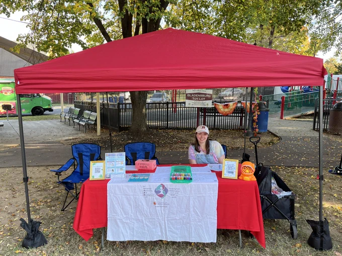 Photo of Ellie smiling at LEAD Lab tent 