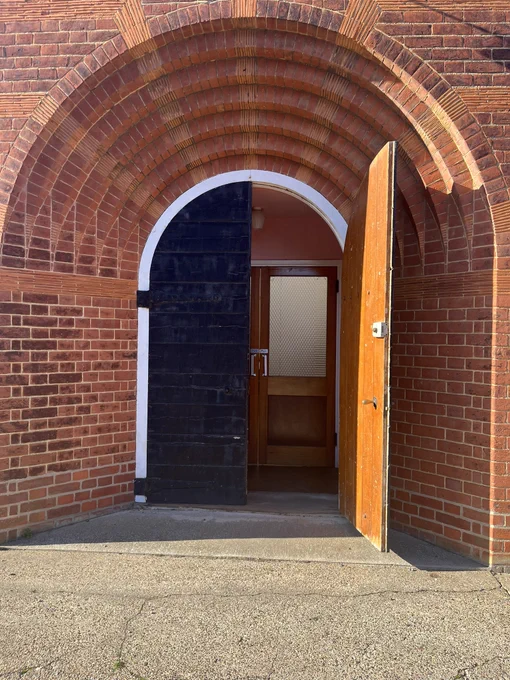 Church door (with a hymn floating out)