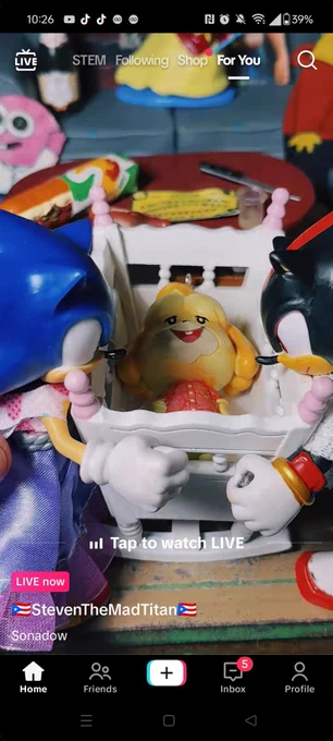 Sonic and Shadow gazing lovingly at their baby, Renesme, who is an Isabelle Animal Crossing doll