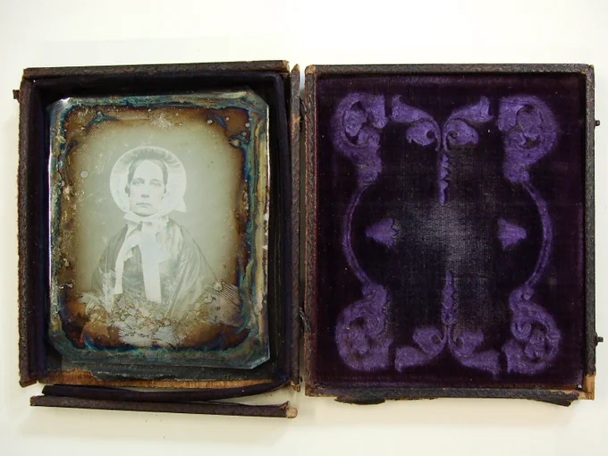 Daguerreotype of an unidentified woman in a purple velvet-lined leather case