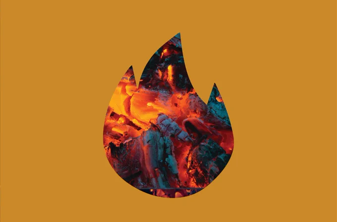 Image of a fire behind a yellow fire cut out. 

