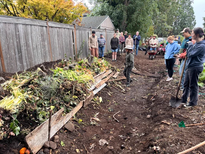 volunteers looking over their garden clean-up and composting work 