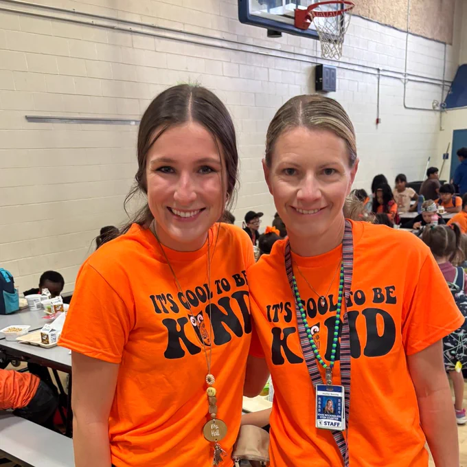 Two John McCandless teachers wear orange t-shirts for Unity Day