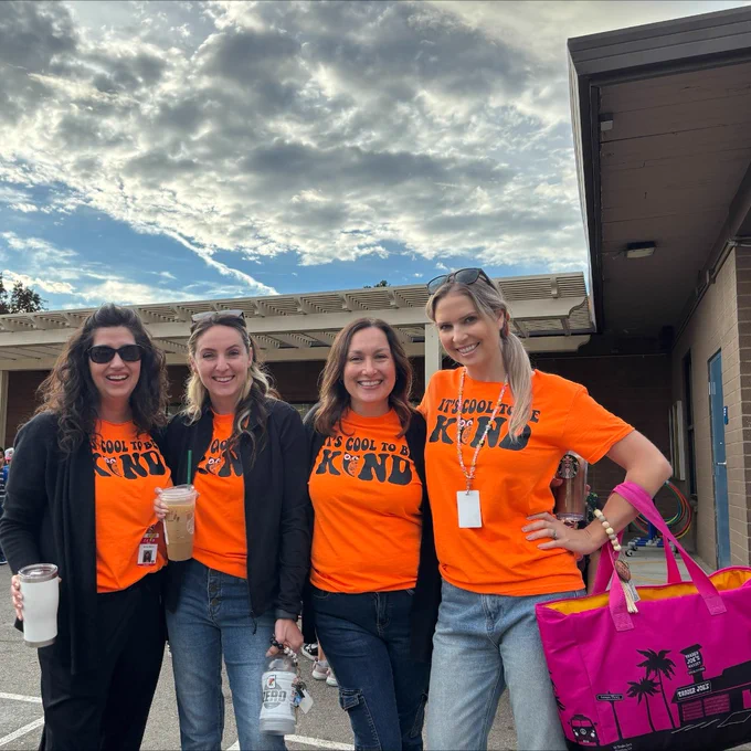 Four John McCandless staff members wear orange shirts for Unity Day
