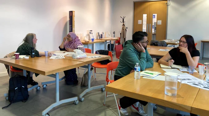 Workshop attendees worked in pairs to create brands for fictional businesses while learning how to develop their own brands. 