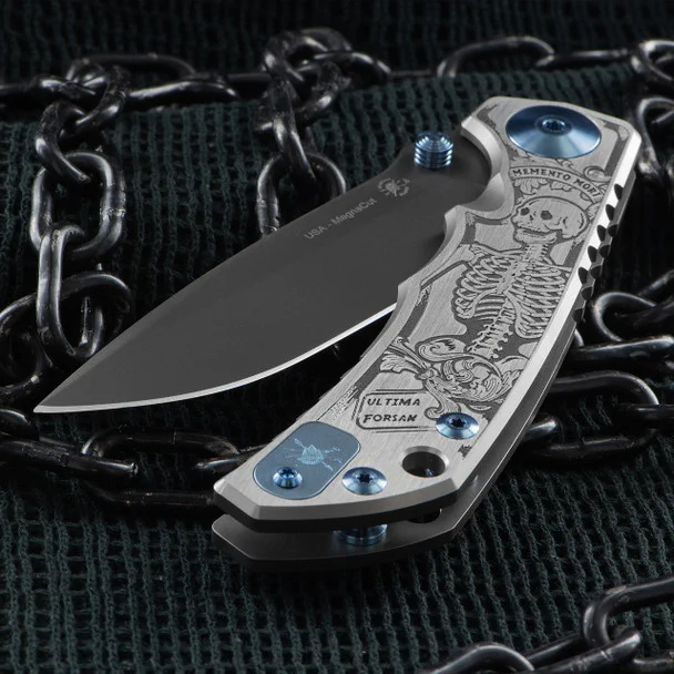 Spartan Harsey Memento Mori Folding Knife born from the synergy of Spartan Blades and the acclaimed knife artisan, William "Bill" Harsey Jr. 

Crafted with meticulous attention to detail, the SHF is more than just a knife; it's a testament to precision and durability. Featuring a titanium construction, premium Magnacut blade, barrel pivot, and stop pin, it stands as a beacon of strength and endurance.