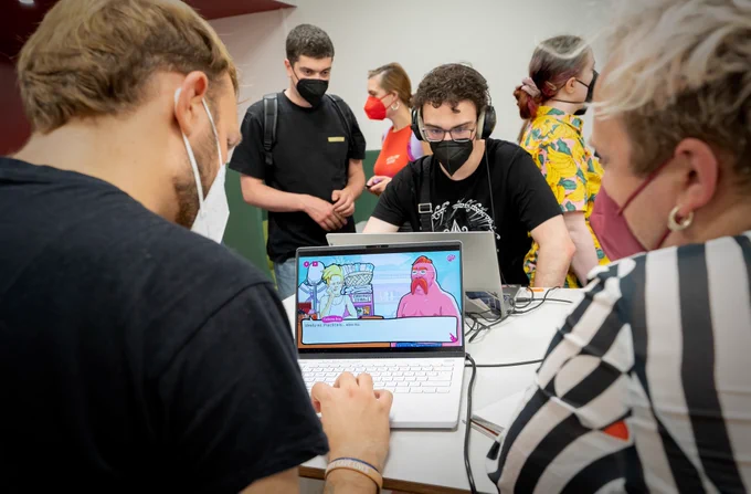 A photo of a laptop on which the game "Private Dick: Murder Aboard The Sea Queen" by Superpose Press is being showcased. One person is playing the game and other people can be seen in the background. Photo taken by Julian Dasgupta at Talk & Play #47. See more at https://www.flickr.com/photos/12601747@N00/albums